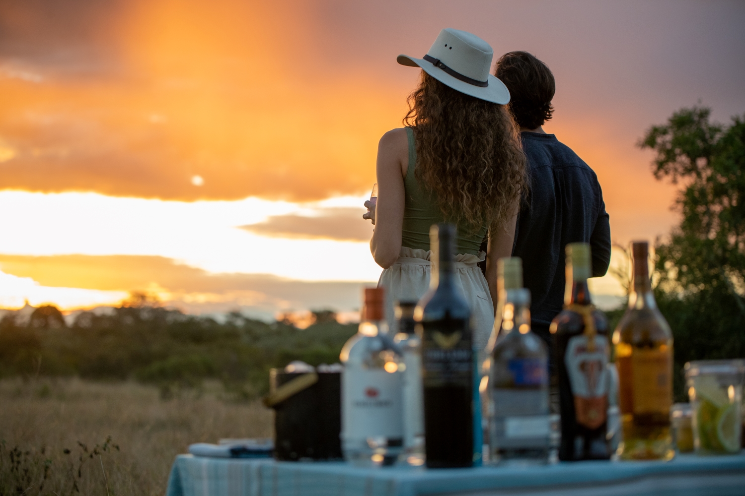 3-Couple-enjoying-sundowners-in-the-wilderness.jpg